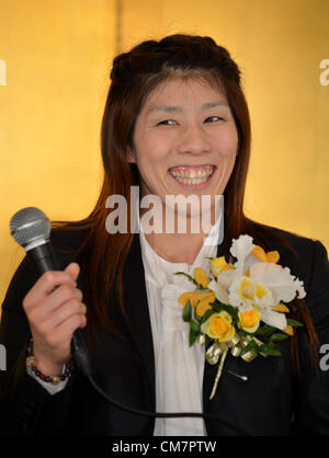 October 23, 2012, Tokyo, Japan - Saori Yoshida, Japan's three-time Olympic wrestling champion, beams a broad smile as she answers questions during a news conference in Tokyo on Tuesday, October 23, 2012, after Japanese government decided to bestow the People's Honor Award on her for 'bringing hope and courage to society.' Yoshida,30, won a total of 13 Olympic and world titles in women's wrestling.  (Photo by Natsuki Sakai/AFLO) AYF -mis- Stock Photo