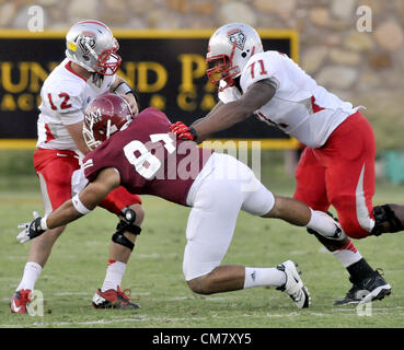 Sept. 22, 2012 - Las Cruces, NM, U.S. - Greg Sorber -- The Lobos'  Darryl Johnson, 71,  protects quarterback B.R. Holbrook , 12, during the game in Aggie Memorial Stadium in Las Cruces on Saturday, September 22, 2012. (Credit Image: © Greg Sorber/Albuquerque Journal/ZUMAPRESS.com) Stock Photo