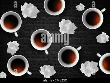 Crumpled colorful papers with coffee on black desktop. Stock Photo