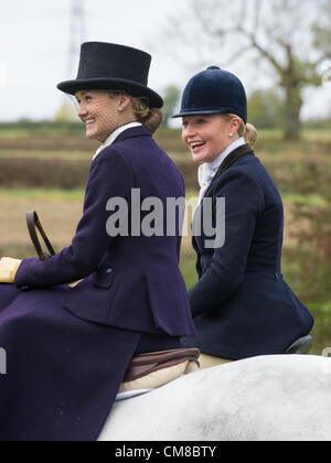 Some of the record number of side saddle enthusiasts taking part in the Opening Meet of the Quorn Hunt, held at the Kennels, Kirby Bellars, England, UK. 26th October 2012. Sidesaddle dates back to antiquity and developed in European countries in the Middle Ages as a way for women in skirts to ride a horse in a modest fashion. In recent years riding side saddle has enjoyed increased popularity thanks to enthusiasts who put on displays at shows and events. Stock Photo