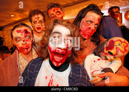 London, UK. 27th October 2012. People dressed up as zombies celebrating Halloween in fancy dress on a pub crawl at the London Halloween Zombie Walk 2012. Stock Photo