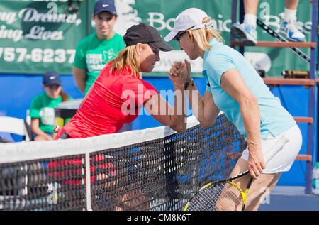 Oct. 27, 2012 - Delray Beach, Florida, U.S. - CHRIS EVERT and MARTINA NAVRATILOVA arm wrestle at the net during the 2012 at the 2012  Chris Evert/Raymond James Pro-Celebrity Tennis Classic. (Credit Image: © Fred Mullane/ZUMAPRESS.com) Stock Photo