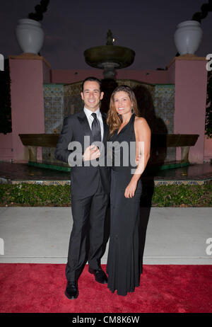 Oct. 27, 2012 - Delray Beach, Florida, U.S. - IndyCar driver, HELIO CASTRONEVES with his wife, ADRIANA HENAO at the 2012  Chris Evert/Raymond James Pro-Celebrity Tennis Classic Gala. (Credit Image: © Fred Mullane/ZUMAPRESS.com) Stock Photo