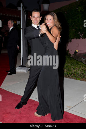 Oct. 27, 2012 - Delray Beach, Florida, U.S. - IndyCar driver, HELIO CASTRONEVES with his wife, ADRIANA HENAO at the 2012  Chris Evert/Raymond James Pro-Celebrity Tennis Classic Gala. (Credit Image: © Fred Mullane/ZUMAPRESS.com) Stock Photo