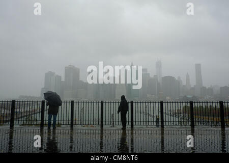 October 29, 2012, Brooklyn, NY, US.  People on the Brooklyn Heights Promenade observe Hurricane Sandy's effects on the East River and Manhattan Stock Photo