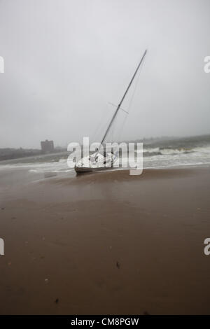 Oct. 29, 2012 - South Boston, Massachusetts, U.S - A boat washes ashore on Carson Beach in South Boston, Massachusetts on Monday, October 29, 2012 during Hurricane Sandy. (Credit Image: © Nicolaus Czarnecki/ZUMAPRESS.com) Stock Photo