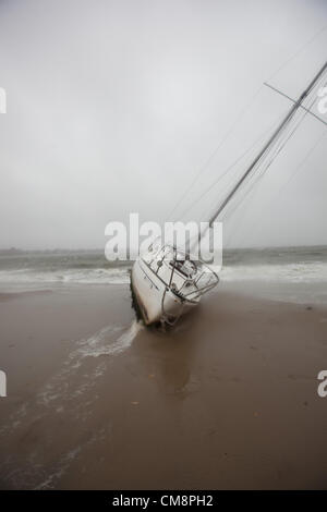 Oct. 29, 2012 - South Boston, Massachusetts, U.S - A boat washes ashore on Carson Beach in South Boston, Massachusetts on Monday, October 29, 2012 during Hurricane Sandy. (Credit Image: © Nicolaus Czarnecki/ZUMAPRESS.com) Stock Photo