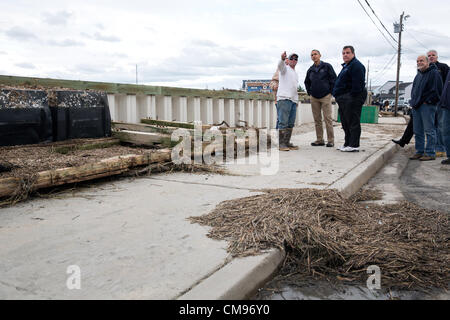 US President Barack Obama and New Jersey Gov. Chris Christie talk with citizens who are recovering from Hurricane Sandy, while surveying storm damage in October 31, 2012 in Brigantine, NJ. Stock Photo