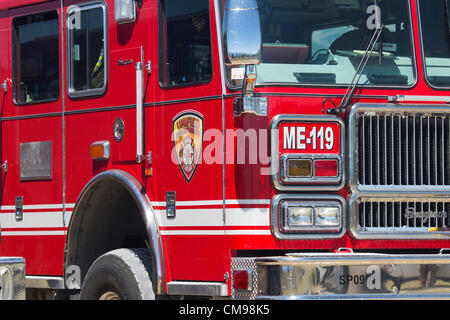 Moroni, Fountain Green, Sanpete County, Utah USA 26 June 2012. Firemen trucks and equipment from throughout the state brief on how to fight a destructive wildfire. Forest wildfire destroys dozens of homes, over 50,000 acres and at least one death by burning. Fire fighters responded from across Utah and several western states to help rescue and extinguish the blaze. Several cities evacuated due to approaching dangers. Briefing before fighting the fire. Destroyed mountain landscape and homes. Largest fire so far this year in Utah. Millions of dollars cost. Stock Photo