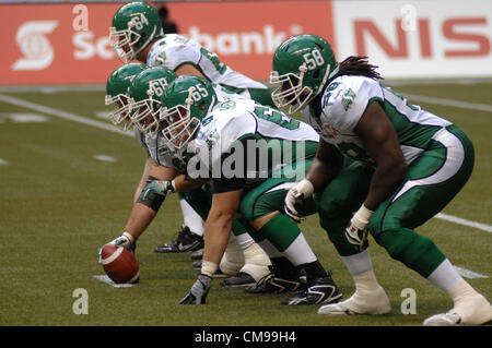 June 13, 2012-Vancouver, BC, Canada-Saskatchewan Roughriders players fight for the ball during a pre-season CFL football game against BC Lions in Vancouver, B.C., on Wednesday June 13, 2012. Lions defeated Roughriders 44-10. Stock Photo