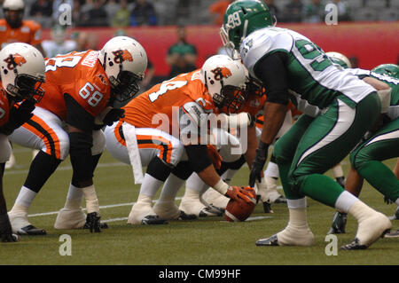 June 13, 2012-Vancouver, BC, Canada-B.C. Lions and Saskatchewan Roughriders players fight for the ball during a pre-season CFL football game in Vancouver, B.C., on Wednesday June 13, 2012. Lions defeated Roughriders 44-10. Stock Photo