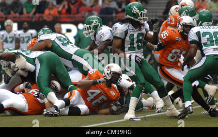 June 13, 2012-Vancouver, BC, Canada-B.C. Lions and Saskatchewan Roughriders players fight for the ball during a pre-season CFL football game in Vancouver, B.C., on Wednesday June 13, 2012. Lions defeated Roughriders 44-10. Stock Photo