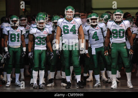 June 13, 2012-Vancouver, BC, Canada- Saskatchewan Roughriders players take to the field to face B.C. Lions during a pre-season CFL football game in Vancouver, B.C., on Wednesday June 13, 2012. Lions defeated Roughriders 44-10. Stock Photo