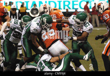 June 13, 2012-Vancouver, BC, Canada-B.C. Lions and Saskatchewan Roughriders players fight for the ball during a pre-season CFL football game in Vancouver, B.C., on Wednesday June 13, 2012. Lions defeated Roughriders 44-10. Stock Photo