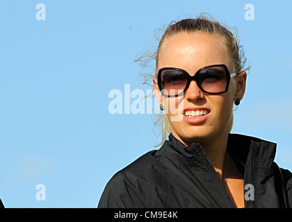 28.06.2012. County Antrim, Northern Ireland. Rory McIlroy's tennis star girlfriend Caroline Wozniacki watches on during the first round of the Irish Open at his hometown course of Royal Portrush in County Antrim, Northern Ireland Stock Photo