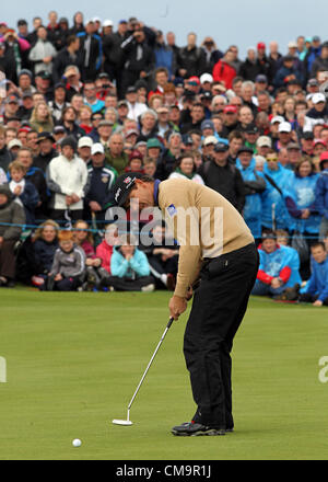30.06.2012. County Antrim, Northern Ireland.  Ireland's Padraig Harrington putts on the 18th green in front of a huge gallery during the third round of the Irish Open golf tournament on the European Tour hosted at Royal Portrush Golf Club, Portrush, County Antrim, Northern Ireland