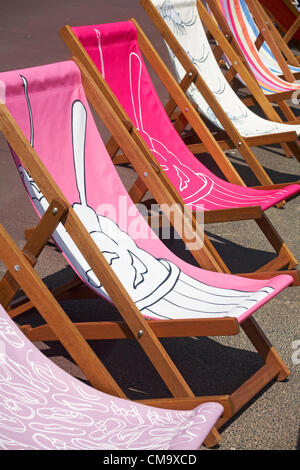 Weymouth, Dorset UK Saturday 30 June 2012. Weymouth Esplanade is decorated with 500 deckchairs designed by locals. Each design celebrates Weymouth and transforms the seafront. Stock Photo
