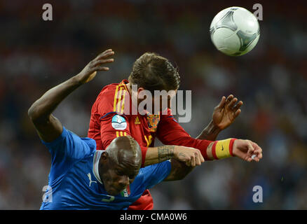 01.07.2012 Kiev, Ukraine.  Spain's Sergio Ramos (top) and Italy's Mario Balotelli challenge for the ball during the UEFA EURO 2012 final soccer match Spain vs. Italy at the Olympic Stadium in Kiev, Ukraine, 01 July 2012. Stock Photo