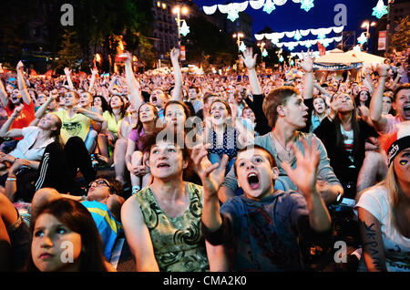 KIEV, UKRAINE - JULY 01: Fans in the fan zone in Kiev watch the UEFA EURO 2012 final match between Spain and Italy / photo by Oleksandr Rupeta Stock Photo