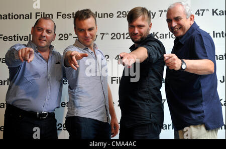 From left to right producer Denis Chouinard, actor Patrice Dubois, director Rafael Ouellet and actor Julien Poulin gesture before the screening of their film Camion during the 47th International Film Festival in Karlovy Vary, Czech Republic, on Sunday, July 1, 2012. (CTK Vit Simanek) Stock Photo