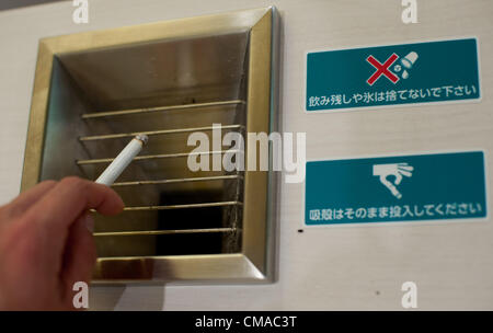 July 4, 2012, Tokyo, Japan – A Japanese company has set up private smoking break centres as increasingly strict anti-smoking laws begin to bite in the country. Costing 50 Japanese yen (approximately 60 cents or 40 pence) the centres offer a refuge for smokers, complete with seating and drinks vending machines.   The company behind the scheme, General Holdings Co., Ltd., has so far opened three “Ippuku” branches (or a small smoking break centers) in Tokyo and plans to open more. Stock Photo