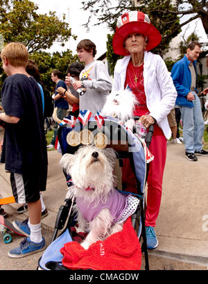 July 04, 2012 - Pacific Palisades, CA, USA -  A marcher and her dog move into position for the start of the Pacific Palisades Americanism Parade.  Home to many familiar names from film and television, the wealthy suburb of Pacific Palisades maintains a small town feel on the outskirts of the megalopolis that is Los Angeles. Stock Photo