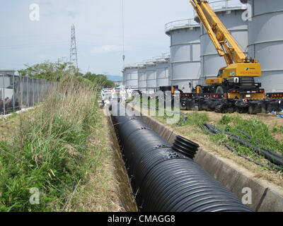 July 5, 2012 - Fukushima, Japan - In this handout picture taken on June 18, 2012 released by Tokyo Electric Power Company, a PE pipe installation is seen at Fukushima Daiichi nuclear power station in Fukushima, Japan. (Credit Image: © Tepco/Jana Press/ZUMAPRESS.com) Stock Photo