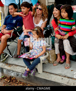 July 04, 2012 - Pacific Palisades, CA, USA -  Spectators watch the annual Pacific Palisades Americanism Parade.  Home to many familiar names from film and television, the wealthy suburb of Pacific Palisades maintains a small town feel on the outskirts of the megalopolis that is Los Angeles. Stock Photo