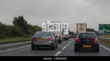 6th July 2012. Northampton UK. Traffic queues  on the A43 from the MI Junction 15A to the Silverstone Circuit, Towcester, Northamptonshire, England, UK. The Formula One Grand Prix of Great Britain will take place on 08th July 2012. The traffic is congested  for 10 miles (16.1 km) this morning due to volume of vehicles trying to get to the Circuit for the weekend and heavy overnight rain. Stock Photo