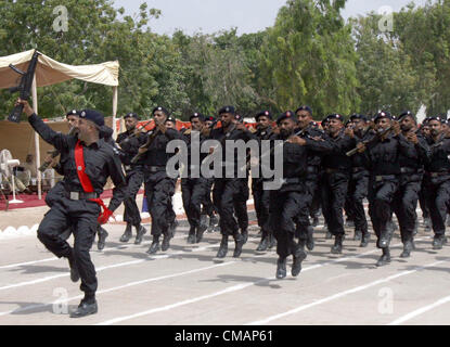 Sindh Police (SP) recruits march-past during passing out  parade ceremony held at Razzaqabad police training center in Karachi on Friday, July 06, 2012. Stock Photo