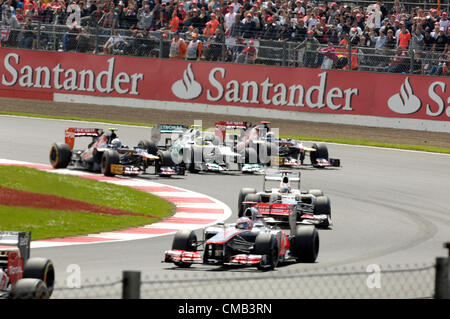 SILVERSTONE, UK, 8th July, 2012. Mark Webber (right) overtakes Fernando Alonso (left) to take the lead in the British Formula 1 Grand Prix. Mark Webber went on to win the Grand Prix. Stock Photo