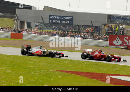 SILVERSTONE, UK, 8th July, 2012. Lewis Hamilton, Mclaren (left) follows Fernando Alonso's Ferrari (right) at the British Formula 1 Grand Prix Stock Photo