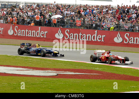 SILVERSTONE, UK, 8th July, 2012. Mark Webber, Red Bull Racing (left) chases Fernando Alonso, Ferrari (right) in the British Formula 1 Grand Prix Stock Photo