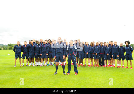 09.07.2012. Champneys Spa and Hotel, Ashby de la Zouch, Leicester. Team GB Football Squad attending the Ladies and Mens training session. Picture shows Stuart Pierce and Hope Powell in front of players: Jack Butland (Birmingham), Jason Steele (Middlesbrough) Ryan Bertrand (Chelsea), Steven Caulker (Tottenham), Craig Dawson (West Brom), Micah Richards (Manchester City), Neil Taylor (Swansea), James Tomkins (West Ham) Joe Allen (Swansea), Tom Cleverley (Manchester United), Jack Cork (Southampton), Ryan Giggs (Manchester United), Aaron Ramsey (Arsenal), Danny Rose (Tottenham), Scott Sinclair (Swa Stock Photo