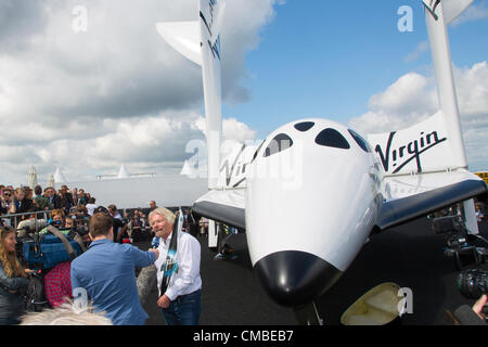 Farnborough, UK. 11th July, 2012. Sir Richard Branson's Virgin Galactic spaceship makes its UK debut at the Farnborough International Airshow. Sir Richard Branson says 529 people have put down deposits to travel into space with Virgin Galactic as the company unveiled its aircraft in the UK for the first time. Stock Photo