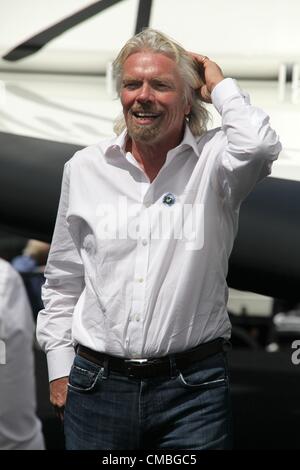 11 June 2012. Farnborough International airshow.  Pictured - Richard Branson of Virgin Galactic appears out of the window.  Full scale replica of SpaceShipTwo (SS2)- a craft intended to take customers on flights to the edge of space.  Branson also announced today a new launcher LauncherOne - intended to piggy back on SS2 and launch small satellites into orbit Stock Photo