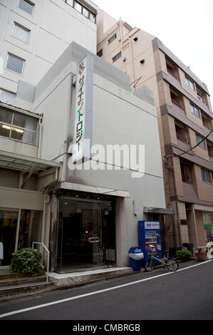 July 13, 2012, Tokyo, Japan - Exterior facade of the 'Church of Scientology' in Tokyo. Scientology was founded by L. Ron Hubbard in Camden, New Jersey in 1952. Scientology operates churches all over the world. It is not recognized as a religion in Japan and the Tokyo headquarters are in one of the less affluent  areas of the Japanese capital. In the picture the sign with rainbow colored letters reads 'Scientology' in the Japanese katakana character set. Stock Photo