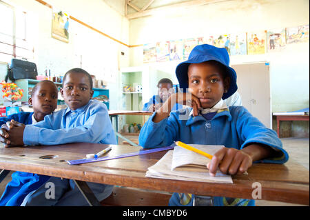 June 21, 2012 - Mhangura (Village, Zimbabwe - June 21, 2012, Makonde, Zimbabwe - Hearing impaired children in class at the Mhangura Mine Primary School in the Makonde District of Zimbabwe. As part of the Enhanced Rural Water Sanitation and Hygiene (ER WASH) project, CRS built 14 latrines at the school to replace the aging structures in place, including two wheelchair accessible toilets for handicapped students. Working through Caritas Zimbabwe, CRS built 256 latrines in three districts of Zimbabwe since 2010 as part of the project. (Credit Image: © David Snyder/ZUMAPRESS.com) Stock Photo