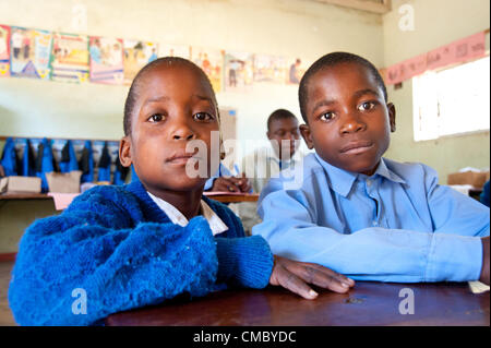 June 21, 2012 - Mhangura (Village, Zimbabwe - June 21, 2012, Makonde, Zimbabwe - Hearing impaired children in class at the Mhangura Mine Primary School in the Makonde District of Zimbabwe. As part of the Enhanced Rural Water Sanitation and Hygiene (ER WASH) project, CRS built 14 latrines at the school to replace the aging structures in place, including two wheelchair accessible toilets for handicapped students. Working through Caritas Zimbabwe, CRS built 256 latrines in three districts of Zimbabwe since 2010 as part of the project. (Credit Image: © David Snyder/ZUMAPRESS.com) Stock Photo