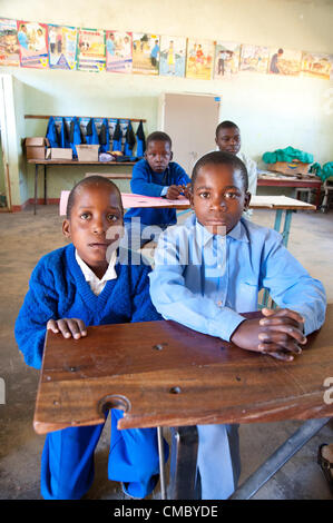 June 21, 2012 - Mhangura (Village, Zimbabwe - June 21, 2012, Makonde, Zimbabwe - Hearing impaired children in class at the Mhangura Mine Primary School in the Makonde District of Zimbabwe. As part of the Enhanced Rural Water Sanitation and Hygiene (ER WASH) project, CRS built 14 latrines at the school to replace the aging structures in place, including two wheelchair accessible toilets for handicapped students. Working through Caritas Zimbabwe, CRS built 256 latrines in three districts of Zimbabwe since 2010 as part of the project. (Credit Image: © David Snyder/ZUMAPRESS.com) Stock Photo