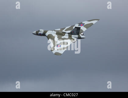 Farnborough, UK. 13 July, 2012. Avro Vulcan XH558 flying at Farnborough International Airshow 2012 on Friday. Since opening the show on Monday in a flypast with the Red Arrows the Vulcan has been on static display but took to the air at the end of Friday's flying display and will be in the air again on Saturday and Sunday. XH558.  Is the only Vulcan bomber still flying and is owned by the 'Vulcan to the Skies' Charitable Trust. Stock Photo