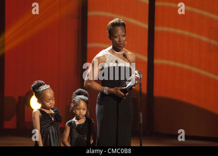 Gail Devers on stage with her daughters Karsen and Legacy, accepts the inductee award for the U.S. Olympic Hall of Fame. Gail Devers is a five-time Olympian and 3 time gold-medal winner. Stock Photo