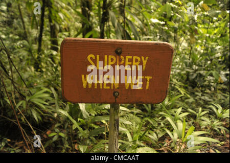 June 13, 2012 - Dominica, U.S. - A sign gives warning along the path to the Emerald Pool in Trois Pitons National Park, Castle Bruce, Dominica Morne. (Credit Image: © Josh Edelson/ZUMAPRESS.com) Stock Photo