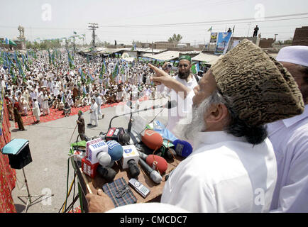 Jamat-e-Islami Ameer, Syed Munawar Hassan  addresses to his supporters during protest rally against reopen of NATO supply, at Jamrud in  Bab-e-Khyber on Tuesday, July 17, 2012. Stock Photo