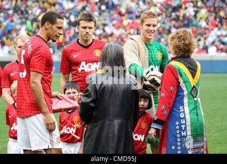 CAPE TOWN, SOUTH AFRICA - JULY 21, Rio Ferdinand from Manchester United FC presents his team to the Premier of the Western Cape Province. Helen Zilleduring the MTN Football Invitational match between Ajax Cape Town and Manchester United from Cape Town Stadium on July 21, 2012 in Cape Town, South Africa Photo by Luke Walker / Gallo Images Stock Photo