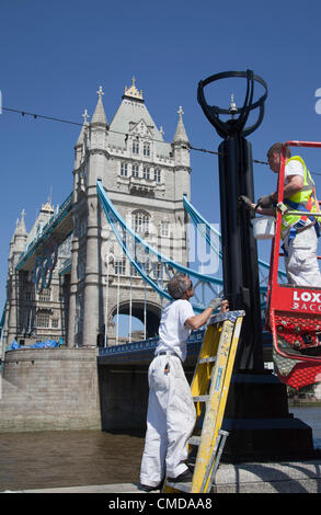 London, England, UK. Monday, 23 July 2012. Painters were out in full force at More London Riverside and Tower Bridge today, 23rd July, to give the town another lick of paint to make the Olympic host city look its best for the 2012 Games. Stock Photo