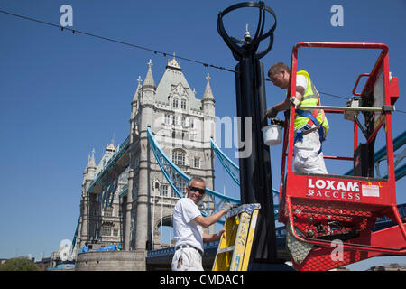 London, England, UK. Monday, 23 July 2012. Painters were out in full force at More London Riverside and Tower Bridge today, 23rd July, to give the town another lick of paint to make the Olympic host city look its best for the 2012 Games. Stock Photo