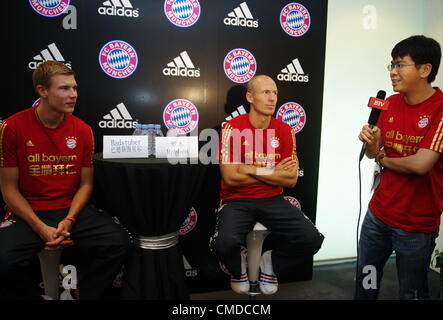 23.07.2012.  Beijing, CHINA; FC Bayern Munchen arrives in Beijing for first 'Yingli Cup' match against Beijing Guoan on July 24th at the Workers Stadium. Arjen Robben and Holger Badstuber at a promotional event at Adidas flagship store. Stock Photo