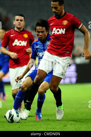 25.07.2012.  Shanghai,  China.  Manchester United versus Shanghai Shenhua in the Chevrolet Cup. Manchster United won the game by 1-0 to take the trophy, as Shinji Kagawa scored his first goal in a Manchester United shirt. Rio Ferdinand clears the defense Stock Photo