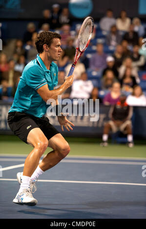 LOS ANGELES, CA - July 24: Tobias Kamkecharges the net during Day 2 of the Farmers Classic presented by Mercedes-Benz at the LA Tennis Center on July 24, 2012 in Los Angeles, California. Stock Photo